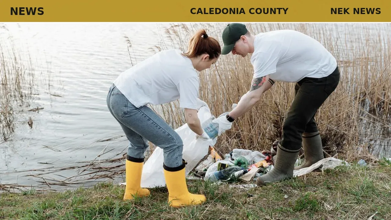Volunteers clean gravestone at Glover cemetery workbee